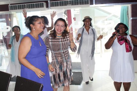 Education Minister Priya Manickchand (left) and Foreign Minister Carolyn Rodrigues-Birkett (second from left) being entertained at the lunch. (Ministry of Education photo)