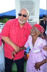 President Donald Ramotar with Sookdai Mohabir, the only surviving witness of the Rosehall Estate shooting which occurred on March 13, 1913, in front of the Rosehall Martyrs’ Memorial.  The occasion was the unveiling on Monday of the memorial at Canje, Berbice to those who died in the rising. (GINA photo)