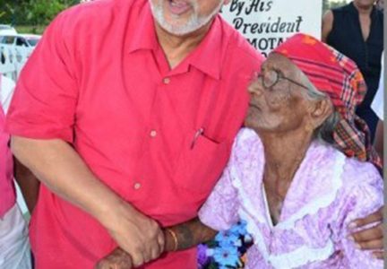 President Donald Ramotar with Sookdai Mohabir, the only surviving witness of the Rosehall Estate shooting which occurred on March 13, 1913, in front of the Rosehall Martyrs’ Memorial.  The occasion was the unveiling on Monday of the memorial at Canje, Berbice to those who died in the rising. (GINA photo)