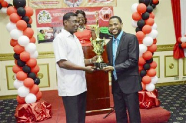 Dr Roscoe Mc Donald (right) receives the Dr. Motilall Award for TB HIV service from Dr Shamdeo Persaud (GINA photo)
