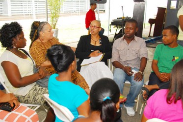 Zenita Nicholson- SASOD (at centre in background) facilitating a group discussion (SASOD photo) 