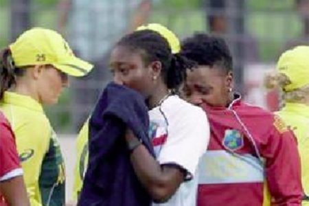 West Indies players Stafanie Taylor and Shanel Daley weep openly following their loss to Australia in the women’s semi-final yesterday. (Photo courtesy WICB Media)
