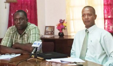 President of the Athletic Association of Guyana (AAG), Aubrey Hutson (right) makes a point at yesterday’s press briefing as VP, Gavin Hope looks on.