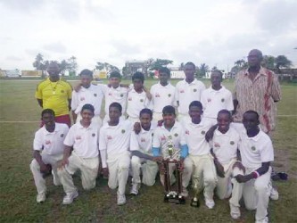 The victorious Demerara under-15 team with Coach Gavin Nedd to the far left and Manager Robert ‘Pacer’ Adonis to the right.