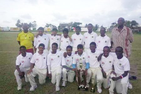 The victorious Demerara under-15 team with Coach Gavin Nedd to the far left and Manager Robert ‘Pacer’ Adonis to the right.