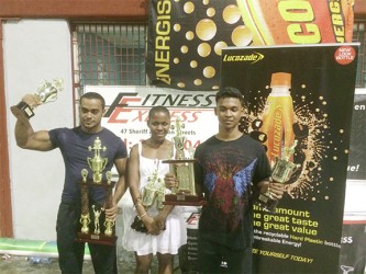 The top lifters of yesterday, Roger Callendar, Andrea Smith and Kevin Briglall posing with their spoils.
