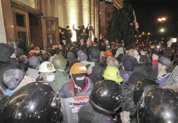 Pro-Russian protesters storm the regional administrative building in Kharkiv yesterday. (REUTERS/Stringer)