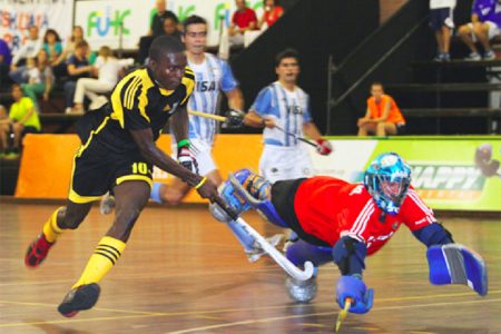 Guyana’s Jamarj Assanah in the process of scoring his goal during the Guyana’s opening matchup with Argentina