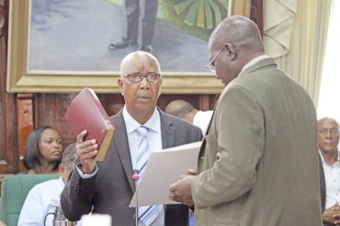 Ernest Elliot taking the oath of office yesterday. 