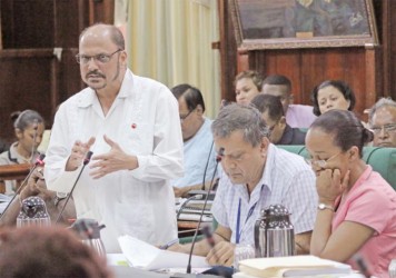 Minister of Health Dr Bheri Ramsaran gestures as he speaks during the consideration of estimates for the 2014 Budget under ‘health’ in the National Assembly yesterday. (Photo by Arian Browne)
