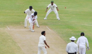 Leg spinner Davendra Bishoo claims the prized wicket of West Indies left-hander Darren Bravo who was plumb lbw. (Clifton Ross photo) 