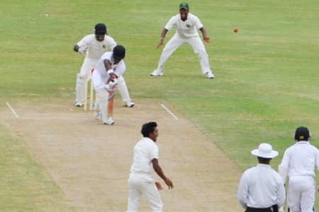 Leg spinner Davendra Bishoo claims the prized wicket of West Indies left-hander Darren Bravo who was plumb lbw. (Clifton Ross photo)