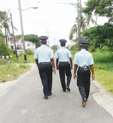 A policeman conducts a random search while on patrol on Sunday 