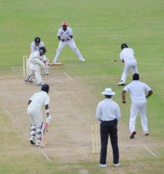 Man of the Match Davendra Bishoo plays a delivery during his unbeaten knock of 25 in the Guyana second innings  yesterday. (Clifton Ross photo) 