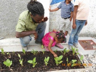 Mark Jacobs engrossed in his work in Haiti