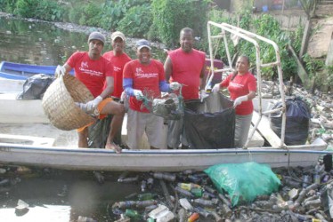 The clean-up of a section of the Port Kaituma River in full swing. A total of 730 bags of garbage were eventually collected.