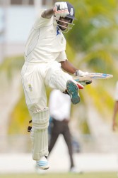 Jonathan Carter celebrates his century yesterday. (Photo courtesy WICB media) 