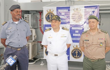 Left to right: GDF Coast Guard Commander Gary Beaton, Brazilian Navy Captain Jackson Sales and Brazilian Military Attaché Colonel Ronaldo Pacheco on deck of the Bocaina