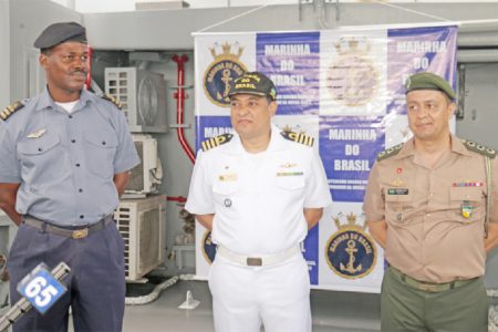 Left to right: GDF Coast Guard Commander Gary Beaton, Brazilian Navy Captain Jackson Sales and Brazilian Military Attaché Colonel Ronaldo Pacheco on deck of the Bocaina