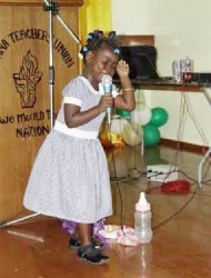 Little Magnolia Legall of the Tuschen Nursery in her element as she recites a poem in dramatic form at the opening ceremony of the Guyana Teachers’ Union (GTU) 4th Biennial Conference last evening. 