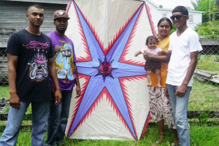 Shazaad Mohood, his wife Reshma and their five-month-old baby along with two friends, Ansar and Nicky pose with the kite before taking sending it up in the air.