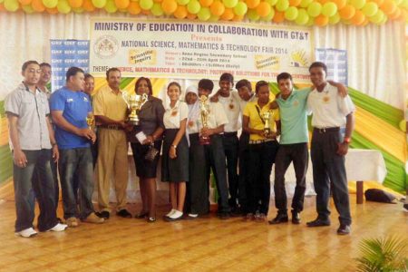 Organizers and students of Region Two pose with the trophy after the region was named Best Overall Region at the National Science, Mathematics and Technology Fair 2014