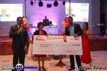  Satish Persaud (at right) presenting the cheque to the Three Rivers Foundation 