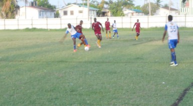 Azuma Small of Sunburst Camptown trying to evade his BK Western Tigers marker during their u17 showdown 