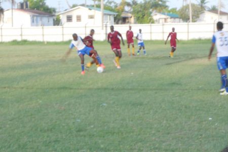 Azuma Small of Sunburst Camptown trying to evade his BK Western Tigers marker during their u17 showdown
