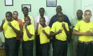 Boxers from the NOC (from left)Andrew Newton, Nicko Jodha, Calvin Barry, Joel Bess and Samuel Forde pose with the GBA top brass and other members of the NOC delegation. 