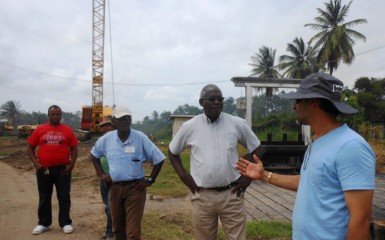 Minister Robeson Benn (second from right) being briefed on the project on Saturday. (Ministry of Public Works photo)