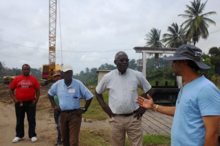 Minister Robeson Benn (second from right) being briefed on the project on Saturday. (Ministry of Public Works photo)