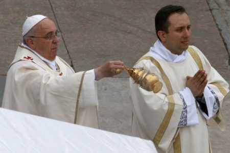 Pope Francis swings incense as he celebrates mass during the canonisation ceremony in St Peter's Square at the Vatican, April 27, 2014.
Credit: Reuters/Stefano Rellandini
