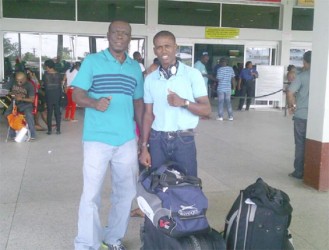 Thumbs Up! Clive Atwell and Coach, Lennox Daniels took a photo for Stabroek Sport yesterday at the CJIA before departing for the US.  