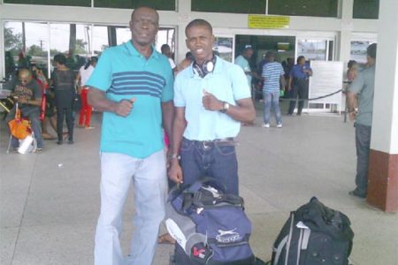 Thumbs Up! Clive Atwell and Coach, Lennox Daniels took a photo for Stabroek Sport yesterday at the CJIA before departing for the US.
