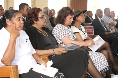 Bibi Webster (first, right) among relatives at her husband’s funeral yesterday. 