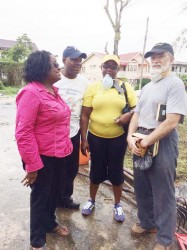 Politician and social activist Dr Faith Harding (left) and Mexican Ambassador to Guyana Francisco Olguin (right) flank GWMO President Simona Broomes and a volunteer at last Sunday’s clean-up exercise.  