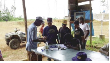 Miners being tested for malaria at a camping site.