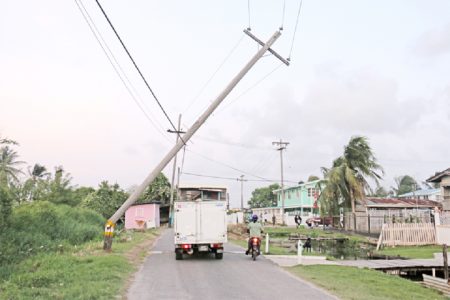 Disaster waiting to happen: This broken electricity pole at Dairy Farm Road, Sophia is being held up by a telephone cable. (Photo by Arian Browne)