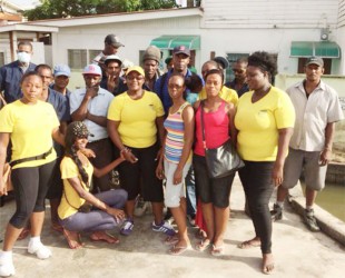 GWMO President Simona Broomes with other members of the GWMO and inmates of the Georgetown Prison after last Sunday’s clean up. 