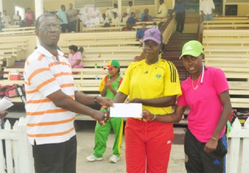 Female winners Shemaine Campbell and Irva Giddings collect their GY$100, 000 check from GCB Competitions Chairman Colin Europe