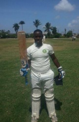 MSC, Nichosie Barker raises his bat after scoring a century against GYO.