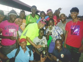   The champions Combined XI with manager Anil Persaud in light green. 