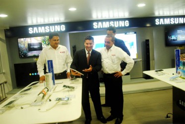 Starr General Manager Rehman Majeed (left) and CEO Mike Mohan with Sam-sung officials Marco Osio (in foreground) and Antonio Legulzamon at the Starr Brickdam Headquarters