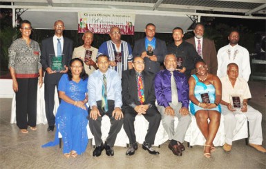 The awardees of the GOA’s Annual Appreciation and Awards Ceremony are flanked by Prime Minister, Samuel Hinds and Minister of Sport, Dr. Frank Anthony. (Orlando Charles photo) 