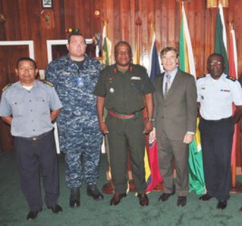 Army Chief of Staff Brigadier Mark Phillips and US Ambassador Brent Hardt (third and fourth from left) are flanked by Coast Guard Capt John Flores (first, left) US Lt Com Robert Novotny and another official at a recent meeting.  