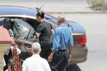 Carol Ann Lynch entering a taxi followed by her father Robert Lynch (right).