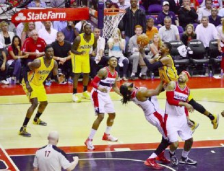 Indiana Pacers forward Paul George (24) shoots over Washington Wizards forward Nene Hilario (42) and is fouled during the fourth quarter of game four of the second round of the 2014 NBA Playoffs at Verizon Center. Indiana Pacers defeated Washington Wizards 95-92. Mandatory Credit: Tommy Gilligan-USA TODAY Sports 