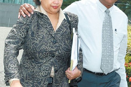 Nyree Alfonso, left, former chairman of First Citizens Bank, leaves the National Academy of the Performing Arts (NAPA), Port-of-Spain, with her husband Towfeek Ali, after publicly resigning the position during the bank’s annual general meeting on Monday. (Trinidad Guardian photo)