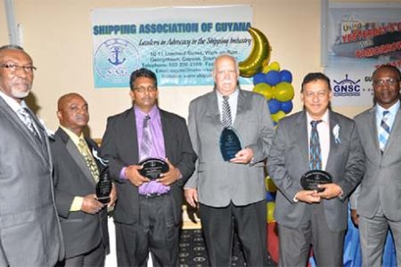 At the shipping association’s dinner and awards ceremony: Shipping Association Chairman Desmond Sears (left) with 2014 individual and group awardees Ian D’Anjou, Kamal Singh, Chris Fernandes, Robin Muneshwer and Barbados Port Authority Head  David Jean-Marie 